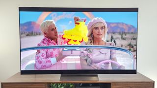 LG C4 OLED TV shown playing Barbie in a living room