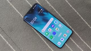 The Oppo Reno 12 Pro on a gray and white background.