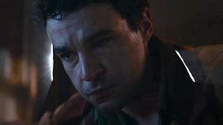 Christopher Abbott doubled over in pain in a cabin in Wolf Man.