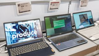 Laptops on a sale display at Best Buy.