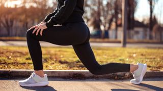 a photo of a woman doing a walking lunge