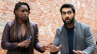 (L-R) Issa Rae as Leilani stands next to a shocked Kumail Nanjiani as Jibran