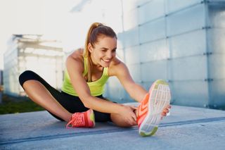 a photo of a woman stretching