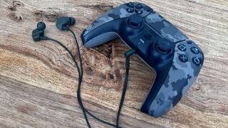 The Final VR2000 earbuds connected to a PS5 DualSense Wireless Controller.
