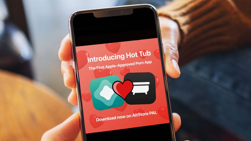 A hand holding an iPhone showing the logo for the Hot Tub app