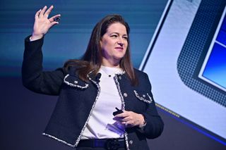 Intel Executive Vice President Michelle Johnston Holthaus holding an Intel Lunar Lake processor