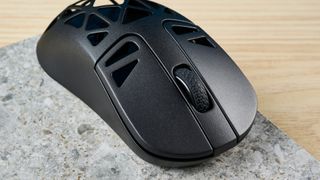 A black Keychron M3 Mini 4K Metal wireless gaming mouse