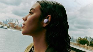 Bose QuietComfort Earbuds 2024 in lilac worn by young woman