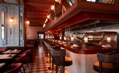 Pink and dark wood interiors of BiBi Indian Restaurant in London 