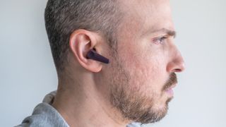 Wearing the Motorola Moto Buds 600 ANC.