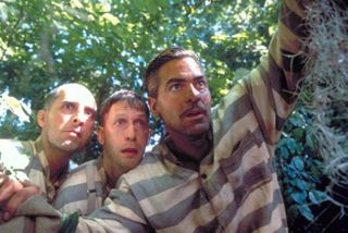 John Turturro as Pete, Tim Blake Nelson as Delmar and George Clooney as Ulysses stare into the distance in O Brother, Where Art Thou?