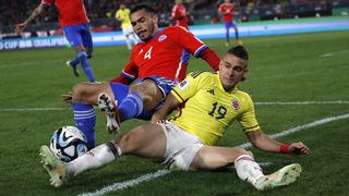 Gabriel Suazo (L) competes for the ball with Rafael Santos Borre (R) during Chile vs Colombia.