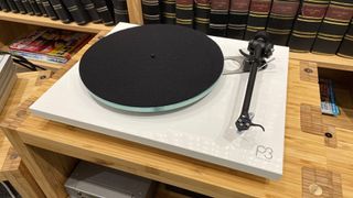 Rega Planar 3 turntable on wooden rack