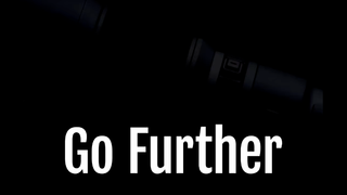 The text 'Go Further' overlayed on a very dark picture of a silhouetted camera lens