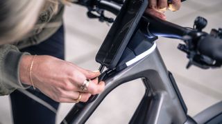 plugging a phone into the Orbea Diem e-bike