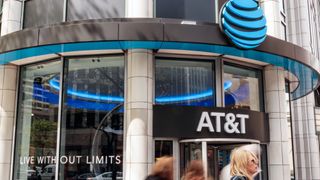 An AT&amp;T store with people walking in front of it