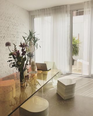 living room with patio door, glass table and soft furnishings