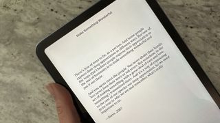 reading a book on an iPad mini 6