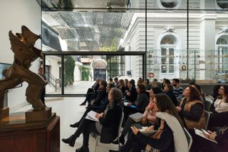 Norman Foster Institute interior with lecture taking place