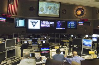 people sitting down and looking at computers