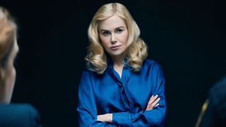 Greer Winbury (Nicole Kidman) in a blue blouse with crossed arms in Netflix's "The Perfect Couple"