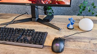 HyperX Pulsefire Core on desk next to keyboard