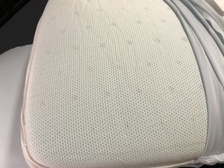 An uncovered Casper Hybrid Pillow with Snow Technology, showing its perforations