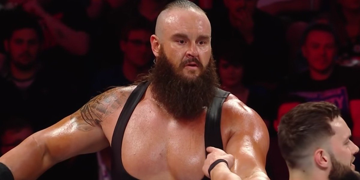 Braun Strowman looking at Finn Balor