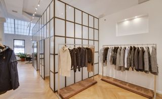 Coats on a rack hanging in Carson Street — New York, USA