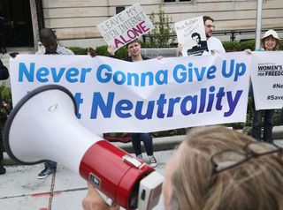 Proponents of net neutrality protest against Federal Communication Commission Chairman Ajit Pai outside the American Enterprise Institute before his arrival on May 5, 2017, in Washington, D.C.