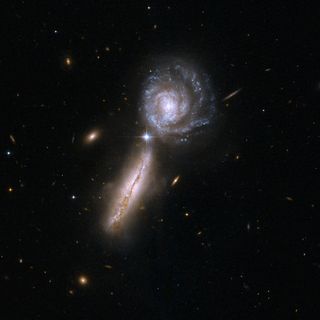 The galaxy pair UGC 9618 and VV 340, two spiral galaxies at the beginning of a collision.