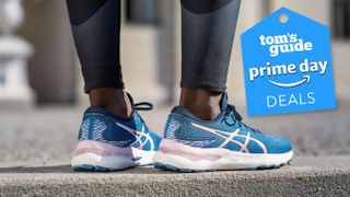 Asics Gel Nimbus 24 running shoe on models feet with Prime Day deal badge