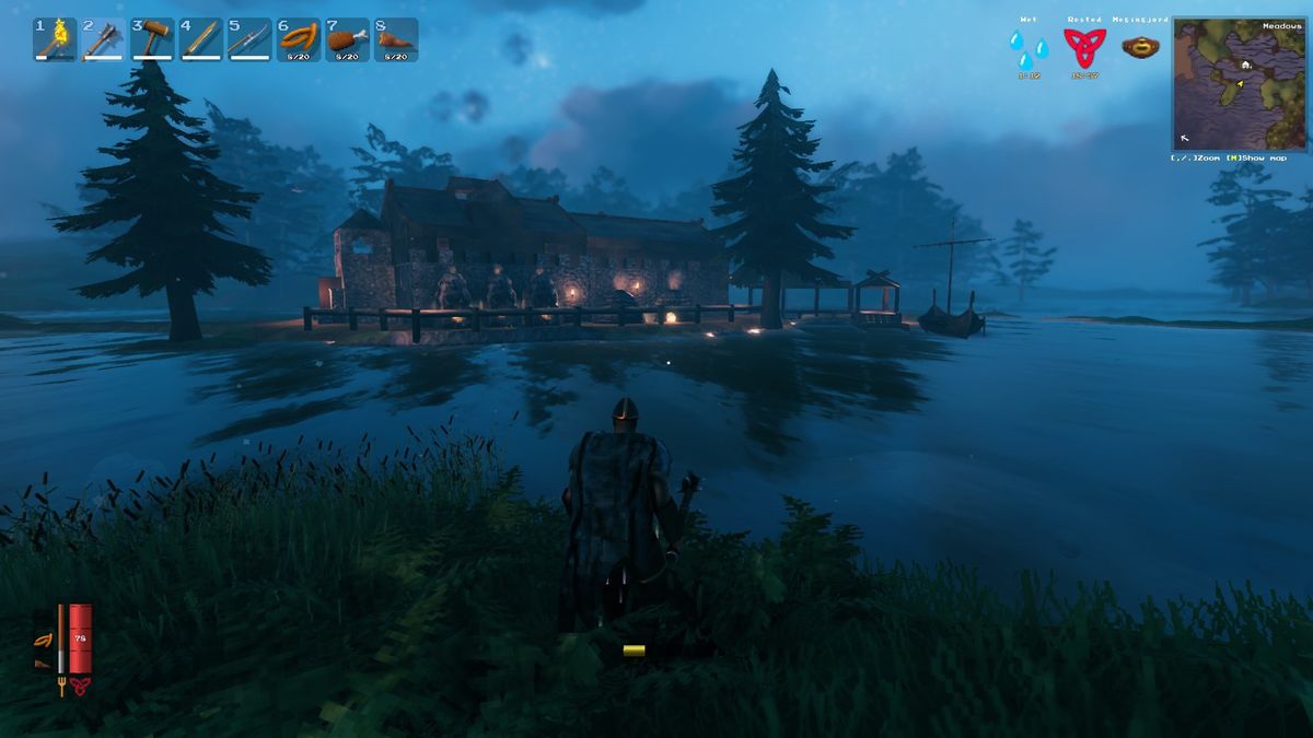 Valheim screenshot showing character viewing a Viking hall and dock