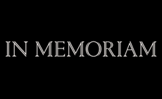 In memoriam in white type on black background