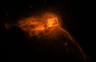 In this wide-field image of Messier 87 from the Chandra X-ray Observatory, the white box indicates the approximate location of the jet.