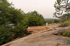 chuzhi house by vinu daniel in india is made of earth and hidden in the landscape, seen here a hint of the exterior