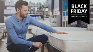 A man in a blue shirt goes mattress shopping during the biggest sales event of the year, Black Friday