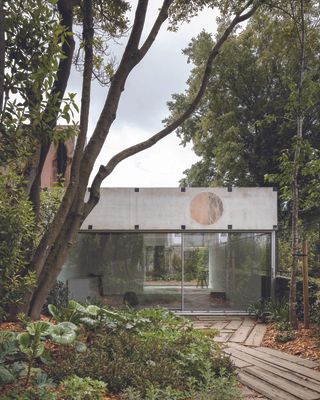 concrete minimalist outbuilding in garden