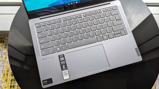 Lenovo Slim 7i 14 Gen 9 top view showing keyboard touchpad and speakers