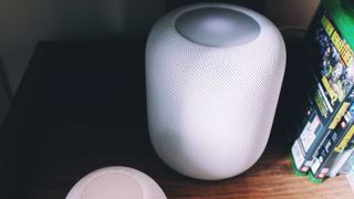 Black HomePod 2 alongside White HomePod 2