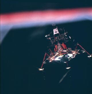 The Apollo 11 lunar module descending to the moon's surface.