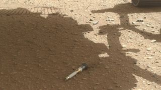 One of the sample tubes dropped by NASA's Perseverance Mars rover at a storage location in Jezero Crater.