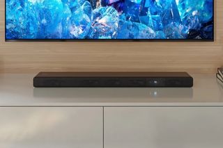 Sony HT-A3000 on a TV cabinet beneath a TV