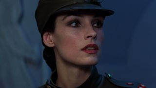 Famke Janssen poses in a uniformed disguise in Goldeneye.