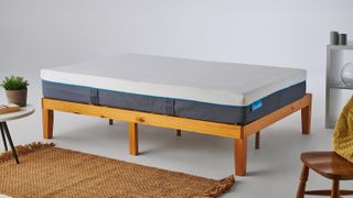 Simba vs Emma: The Simba Hybrid Mattress photographed on a light wooden bed frame