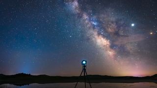 camera on a tripod under the stars