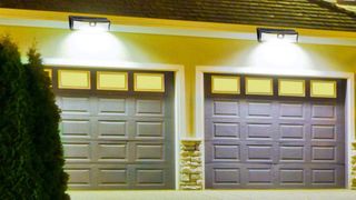 Aootek Solar Outdoor Flood Lights over garage