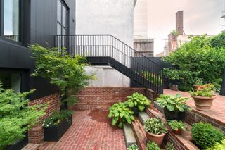 garden view of house Stick House, Brick Garden