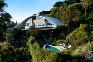 House on raised platform with outdoor pool