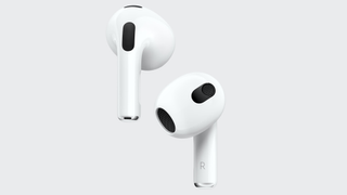 Apple AirPods 3 earpieces with a grey background